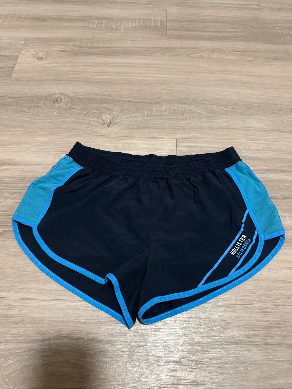 Hollister Women's Black Athletic Shorts with Blue Trim